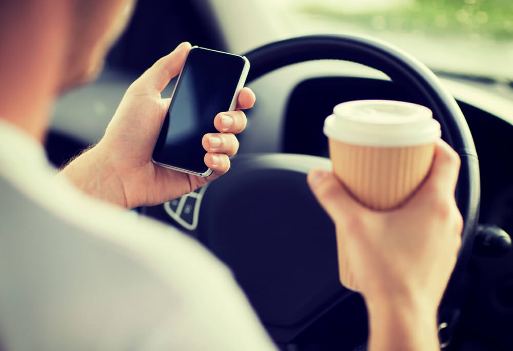 using phone and eating while driving