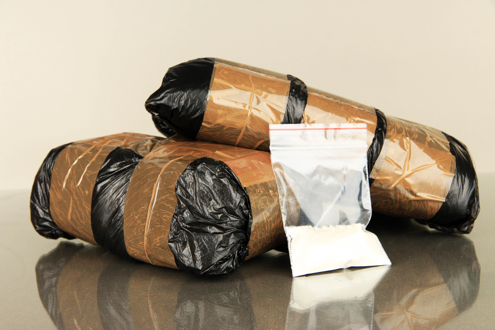 Packages of narcotics on gray background