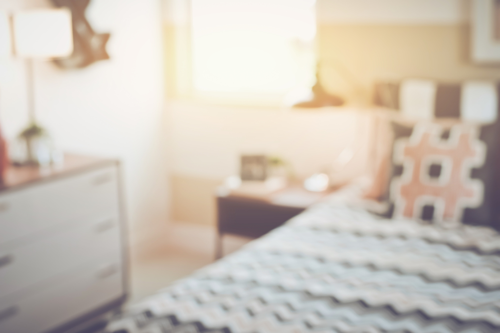 Blurred Bedroom with Bed and Nightstand with Retro Instagram Sty