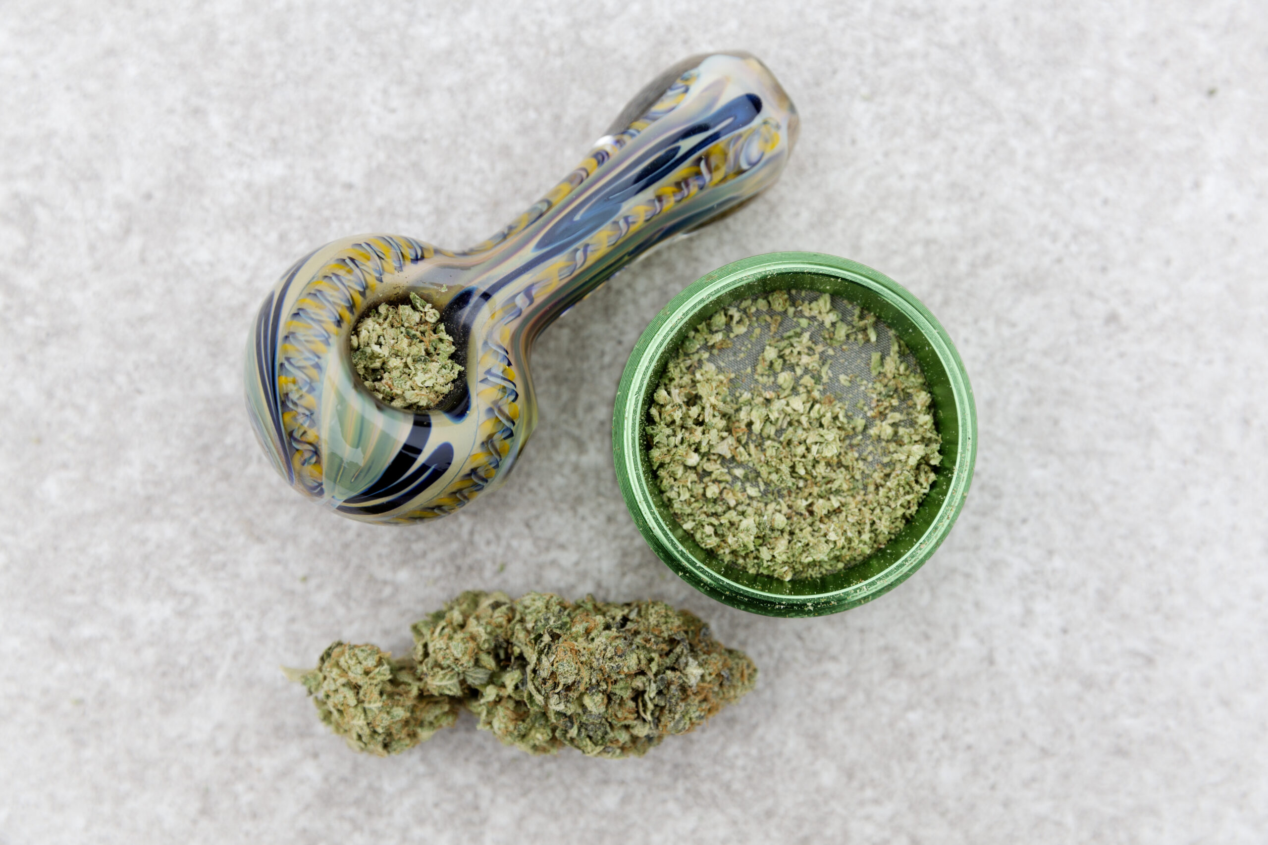 Marijuana Pipe, grinder and nug.