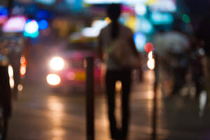 blurry image of city sidewalk