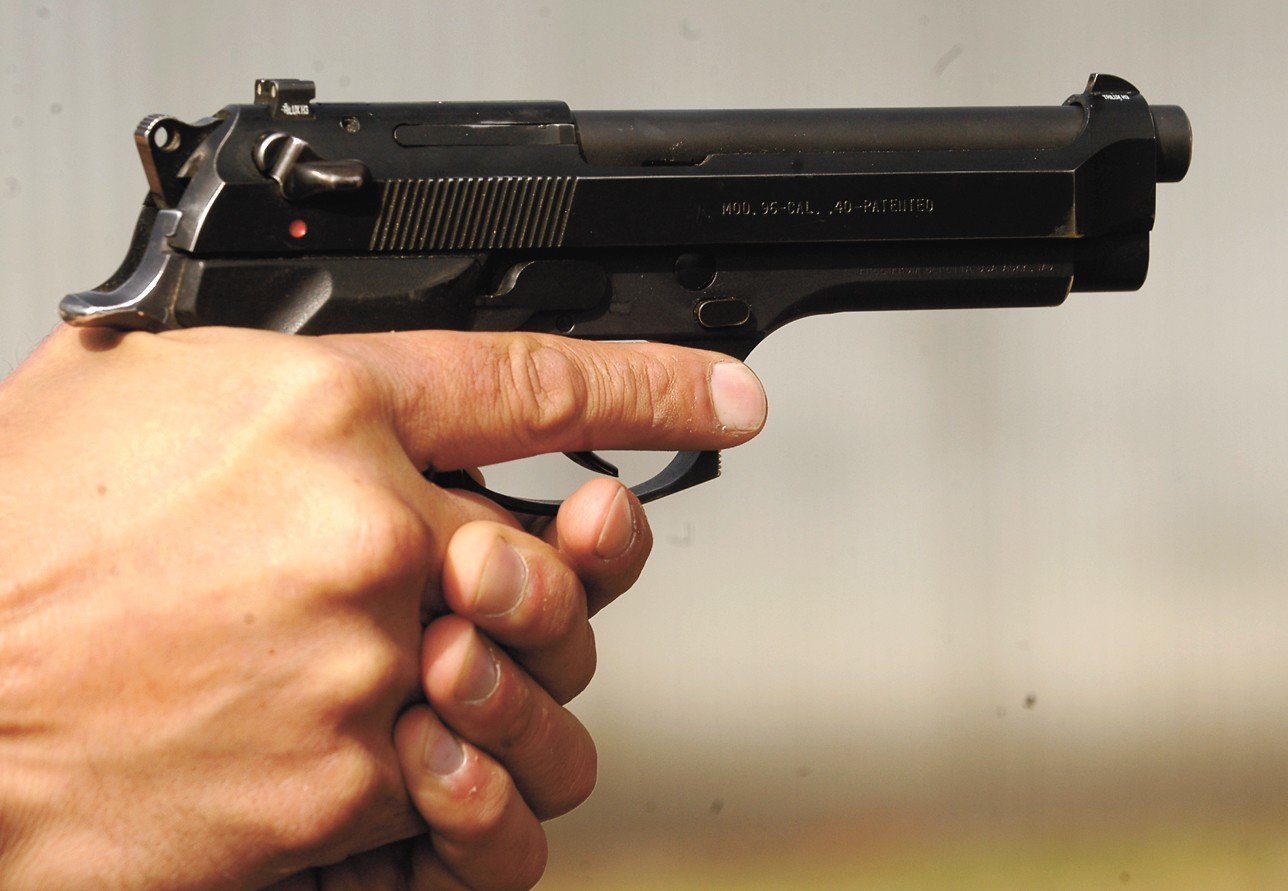 holding gun