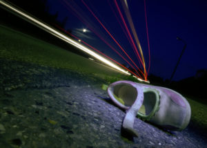 shoe on side of road