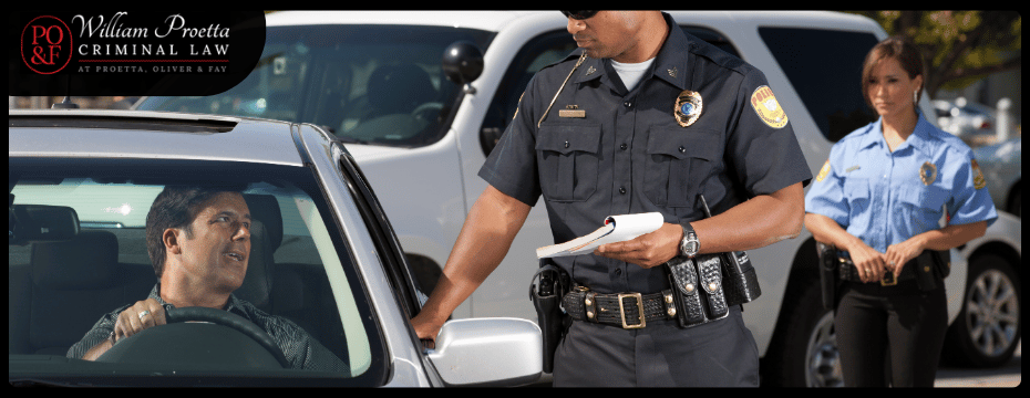 policeman talking to a person in a car